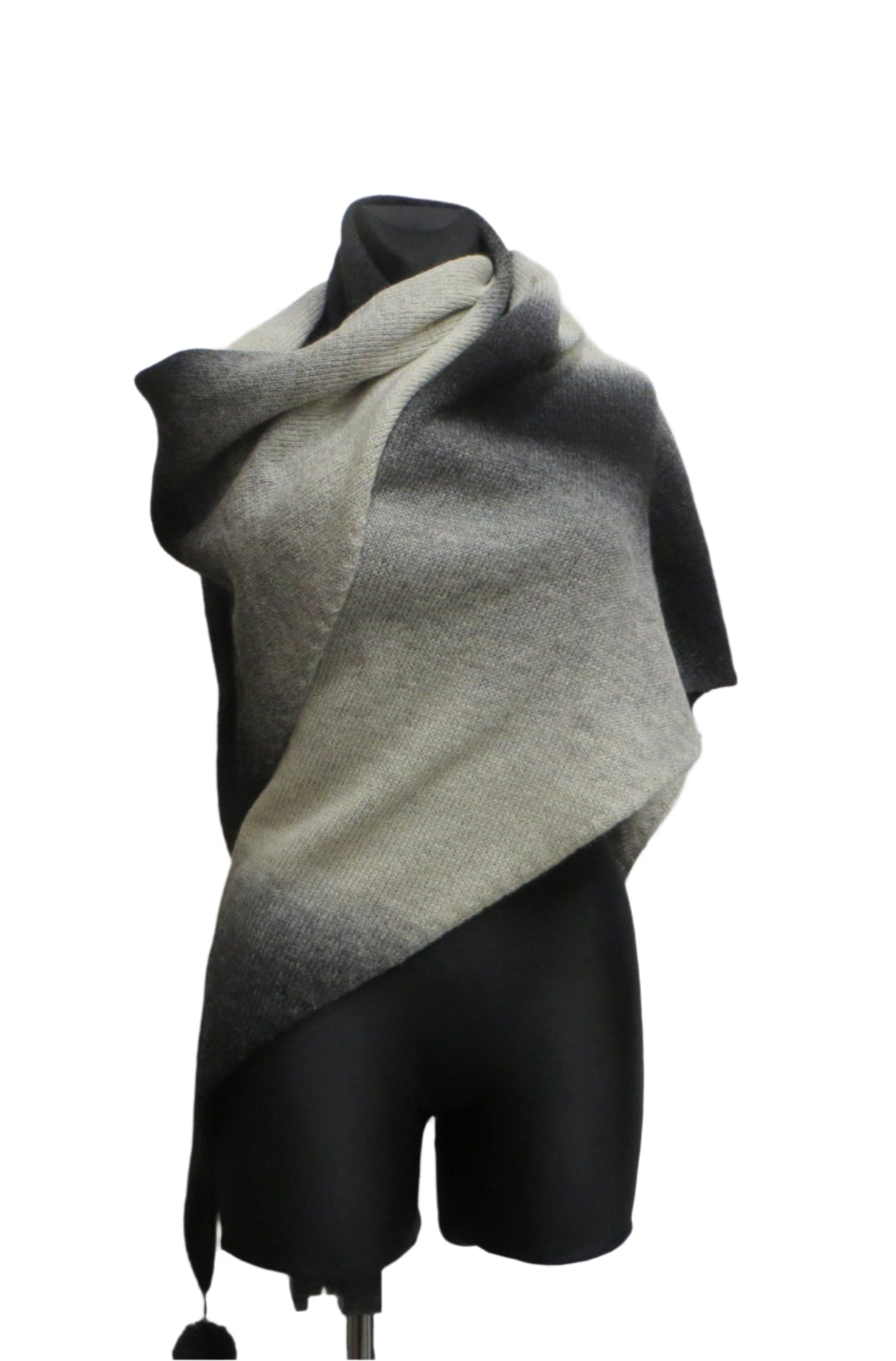 Knitted Triangle Wool Shawl in White and Black Gradient.