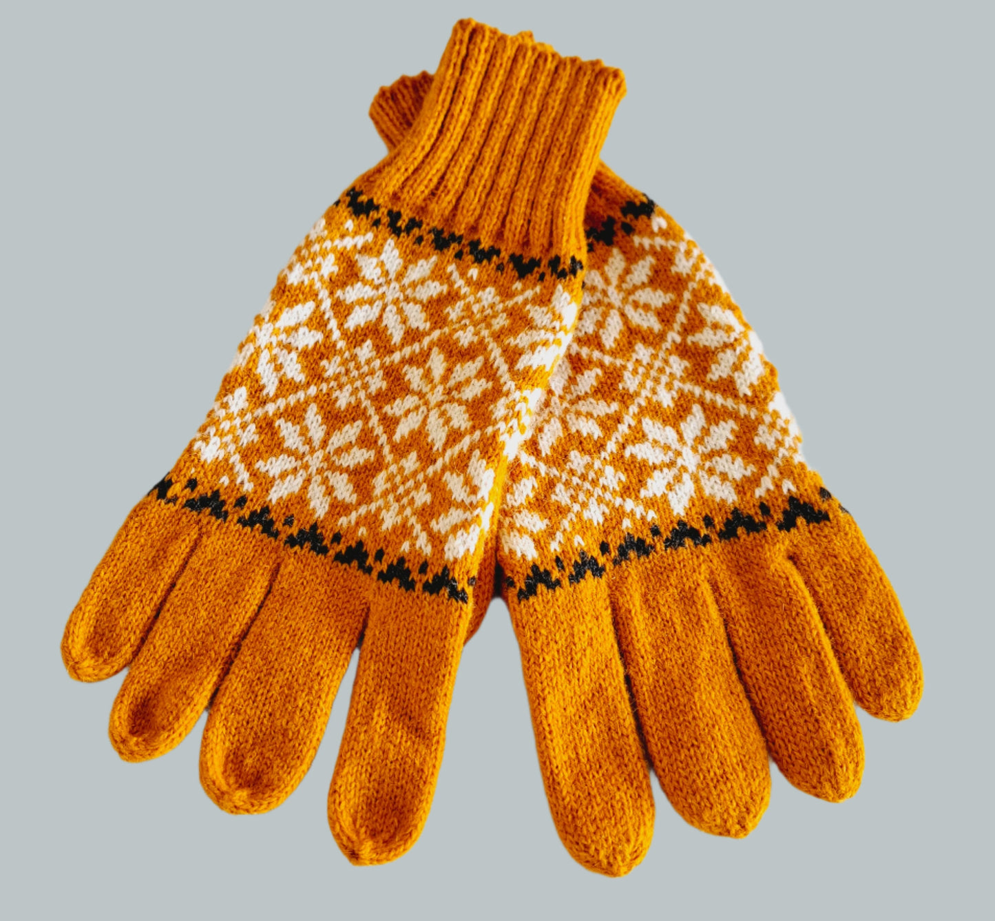 Knitted Wool Gloves in Orange with White Stars.