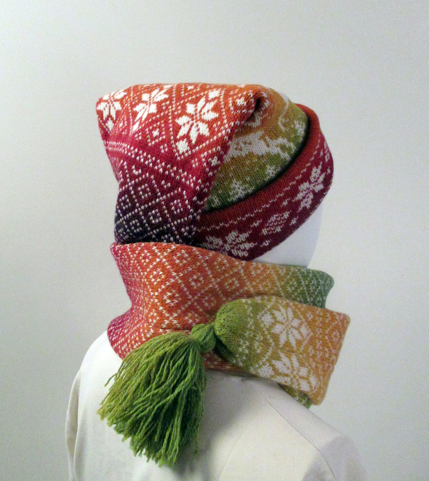 Long Knitted Nordic Stocking Hat in Rainbow Gradient.