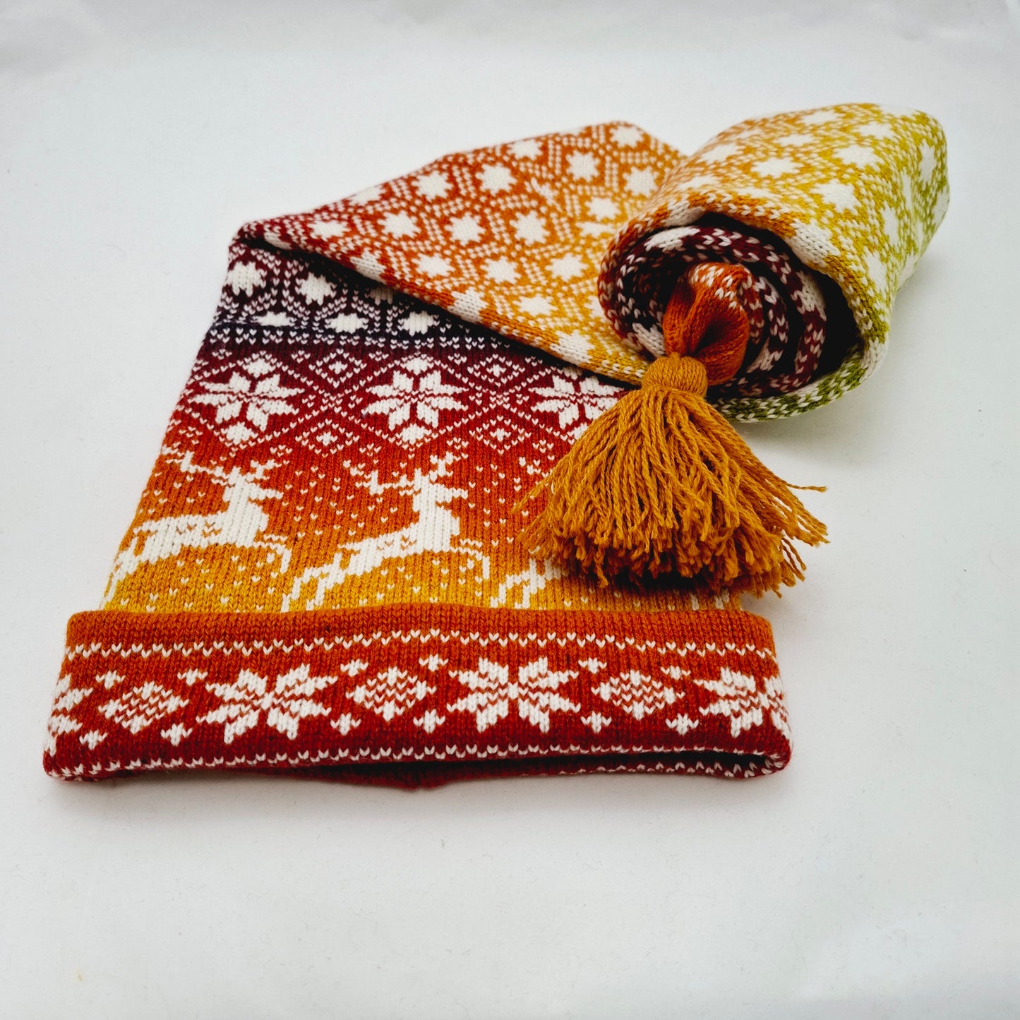 Long Knitted Nordic Stocking Hat in Orange Gradient.