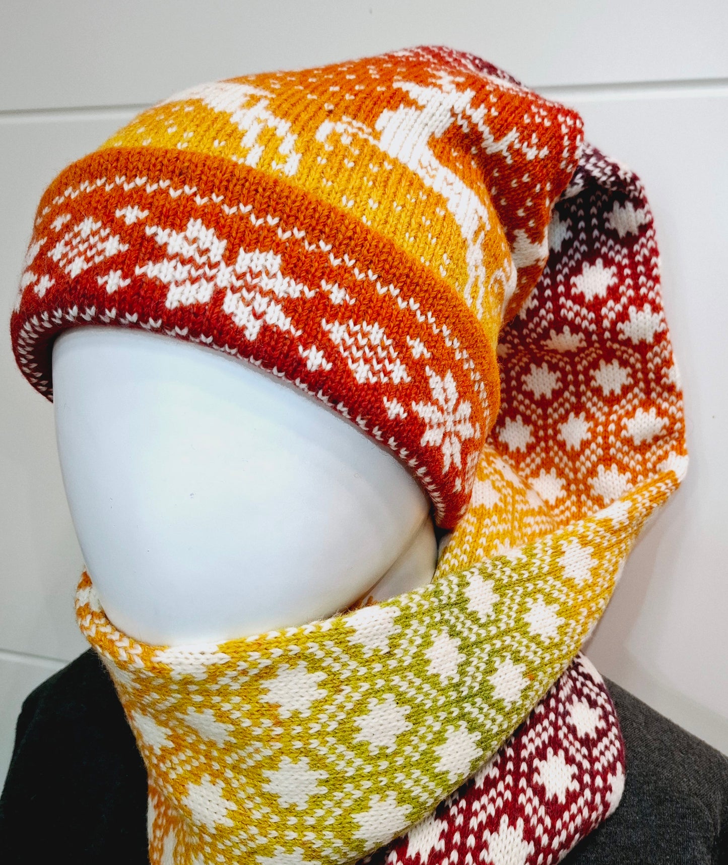 Long Knitted Nordic Stocking Hat in Orange Gradient.